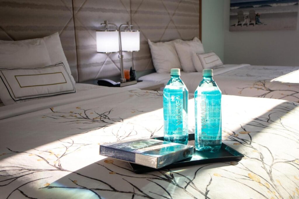 NEW 2026-Ocean Sands Beach Boutique Inn-Sauna and Salt-Mineral Pool -Free Beach Bikes and Famous Beach- Fresh Baked Cookies and Popcorn - Bathrobes and Sunscreen in all rooms-Ultra Sparkling-Free Laundry- 4 Grand Black Beds-Call NOW & Save-1-252-AHA-SAND - Image 6